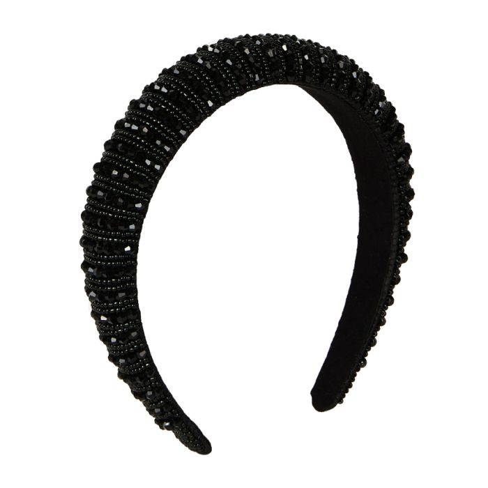 A black velvet headband embellished with black beads in two different shapes, tiny round beads and angular, diamond-cut beads. 