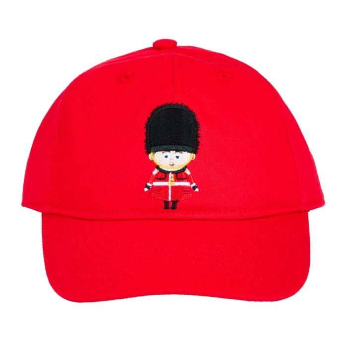 A red baseball cap for kids with an embroidered Royal Guard character on the front in red, black and yellow. 