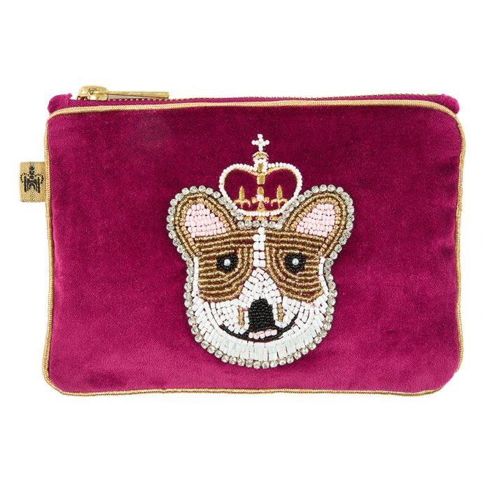 Purse decorated with detailed embroidered of a corgi dog using black, white and brown beads