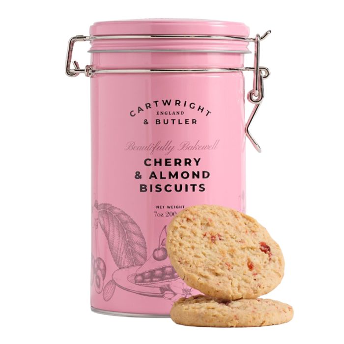 A pink biscuit tin with cherry and almond flavoured biscuits. 