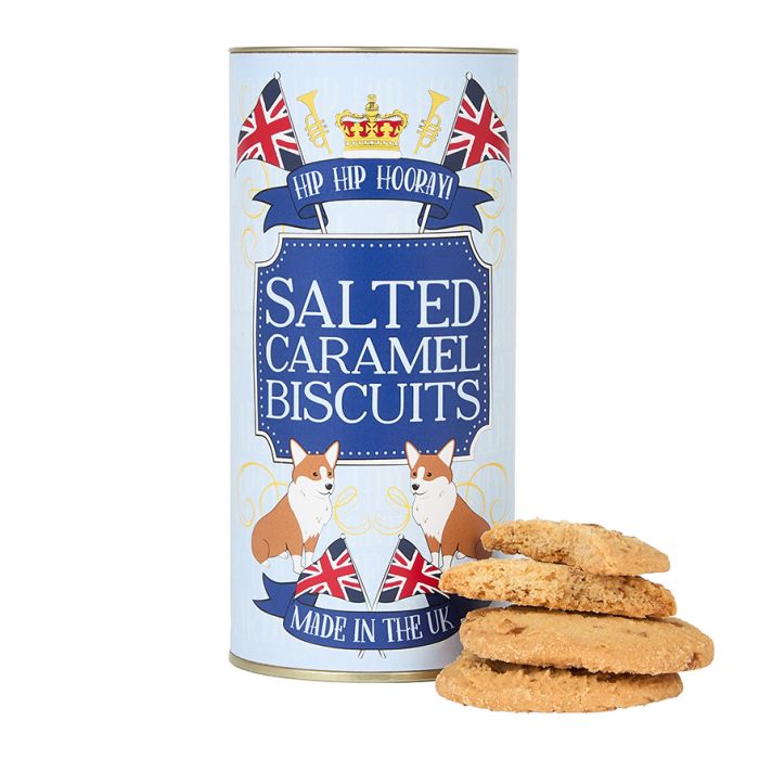 A light-blue cylinder tin with corgi dogs, Union Jacks and a crown motif, filled with salted caramel biscuits.
