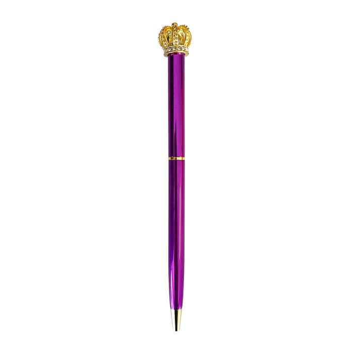 A metallic purple biro pen topped with a gold crown on the end. 