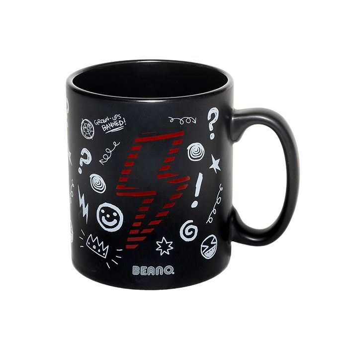 A black mug with white comic-book style doodles and a red and black stripe lightning bolt.