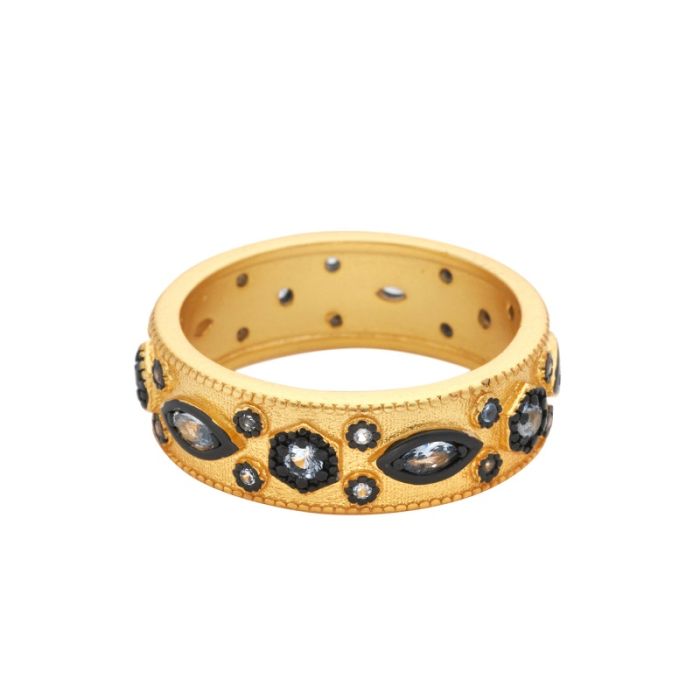 A  gold band ring with black detailing and Cubic Zirconia.