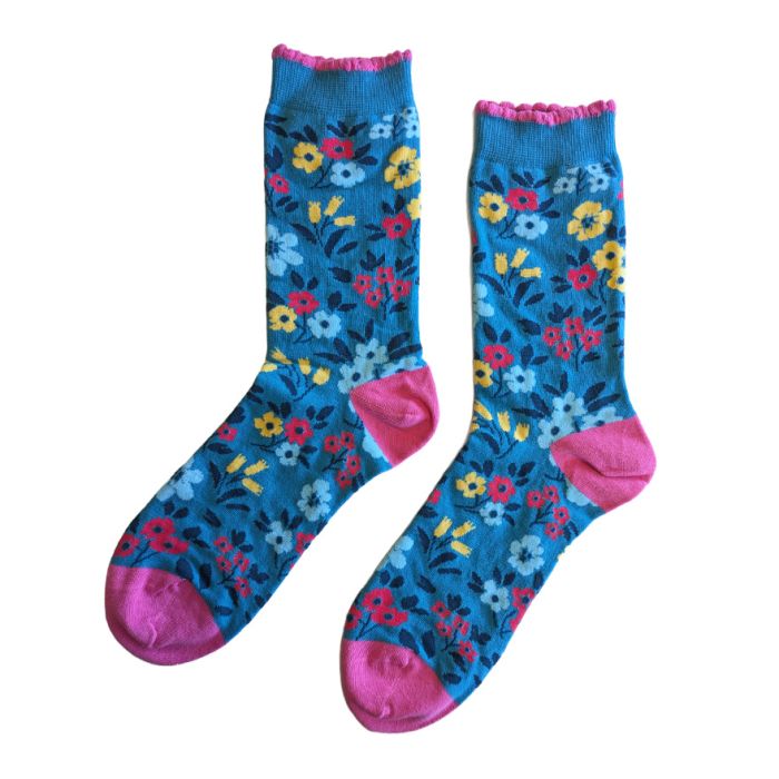 Blue women’s socks with red, yellow and light blue floral pattern and pink cuff, heel and toe.