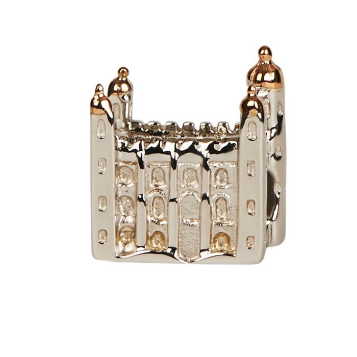 A silver charm bead in the shape of the White Tower with delicate window details. The turrets are made from rose gold