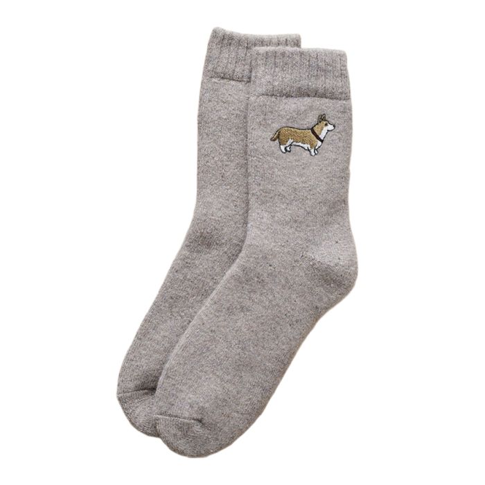 taupe-coloured wool socks with a small embroidered corgi dog on the ankle. 