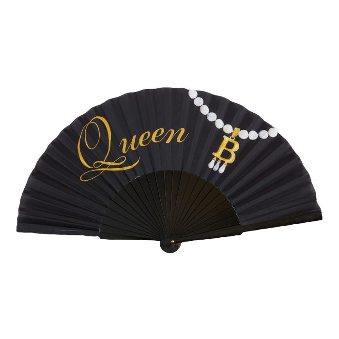 A black folding hand fan with gold text reading, Queen B. The letter B is illustrated to look like it's part of Anne Boleyn's famous gold and pearl initial necklace. 