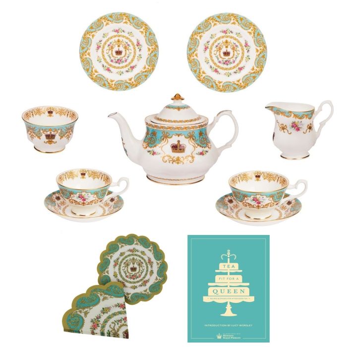 A turquoise, white and gold patterned tea set with a royal crown and roses design on each piece.