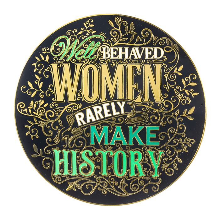 A round coaster with a typographic design in black, green and gold that reads Well behaved women rarely make history.