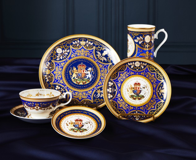 King Charles III Coronation commemorative china set in royal blue and gold with ornate crest detailing.